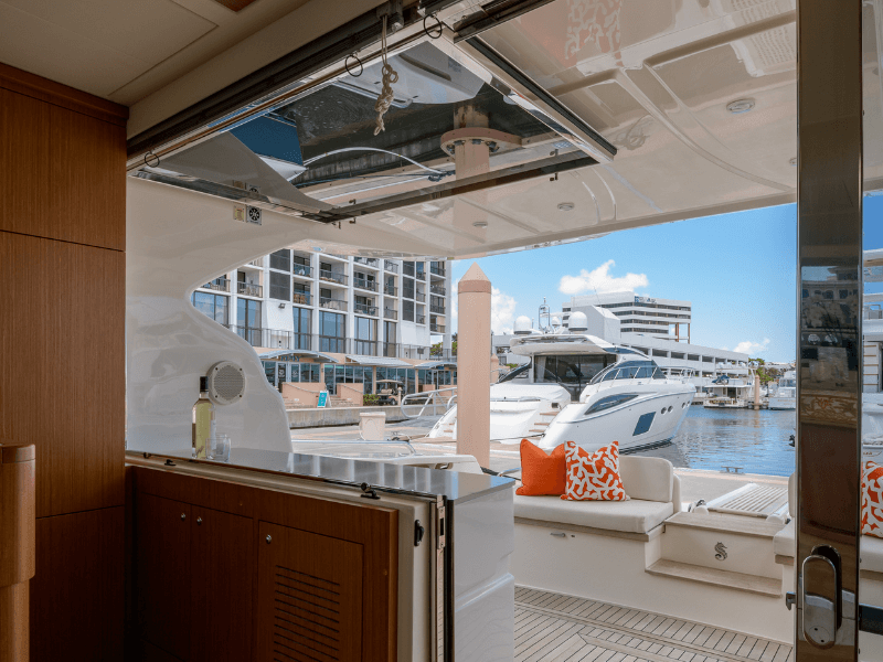 Inside of a yacht with view of a resort marina.